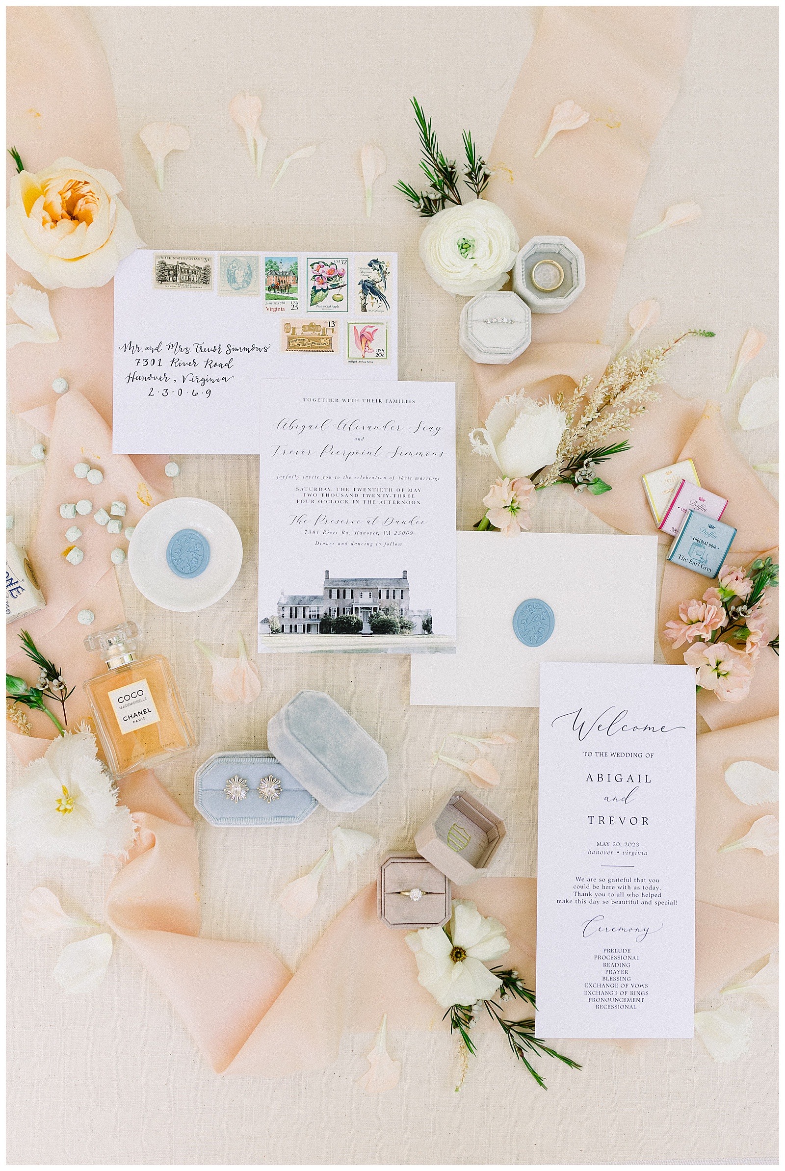 peach and blue wedding invitation flat lay