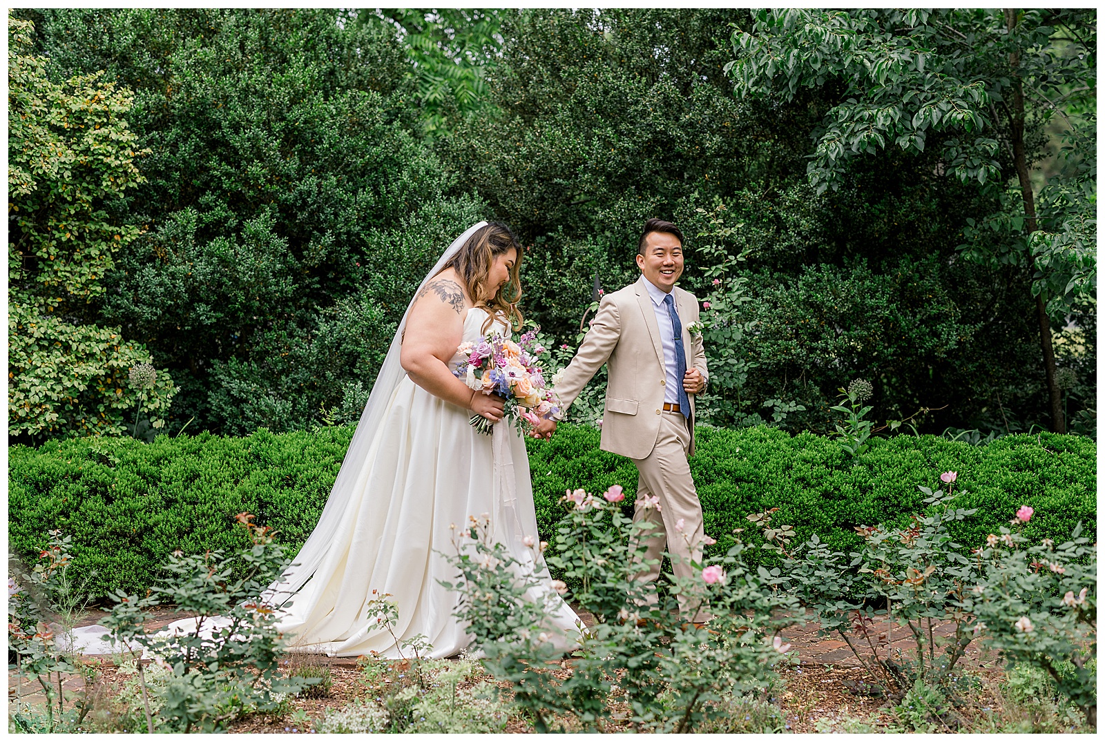 bride and groom walking in garden
