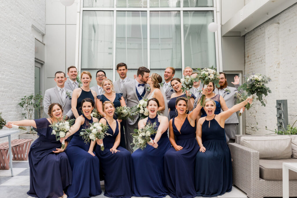 wedding party portrait cheering inside Quirk Hotel Richmond