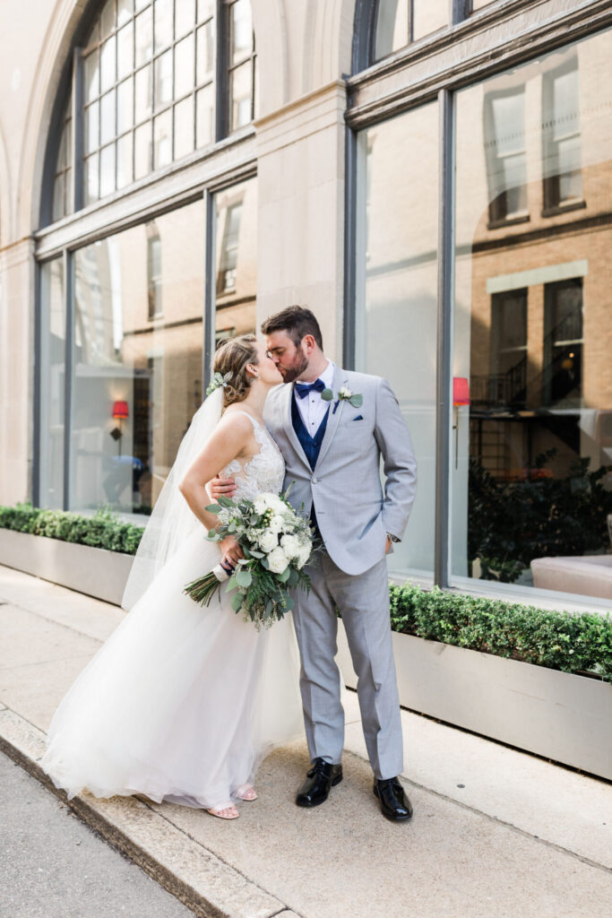 bride and groom kissing during portraits at Quirk Hotel Richmond