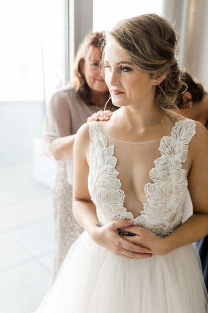 mom touches bride's shoulder at Quirk Hotel Richmond
