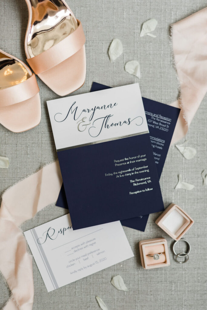 Wedding invitations and shoes on gray flay lay at Quirk Hotel Richmond