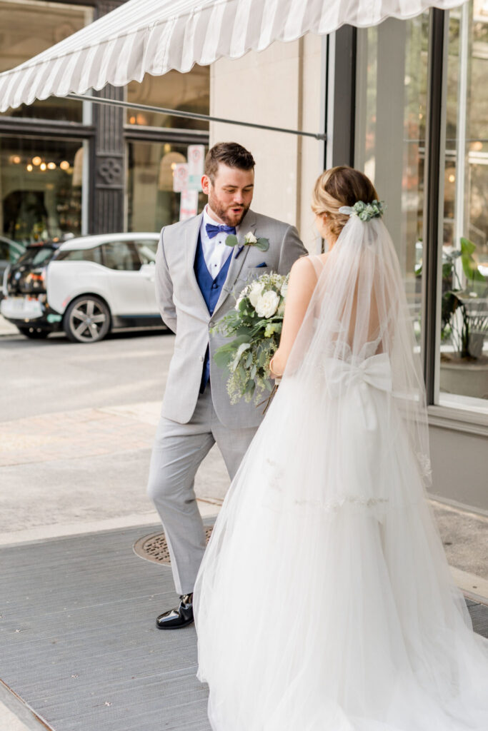 bride and groom first look in front of Quirk hotel richmond