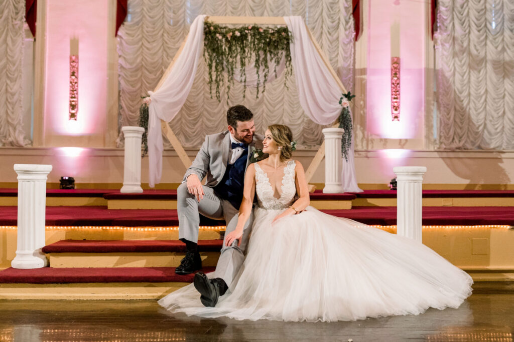 bride and groom posing on stage at The Renaissance Richmond