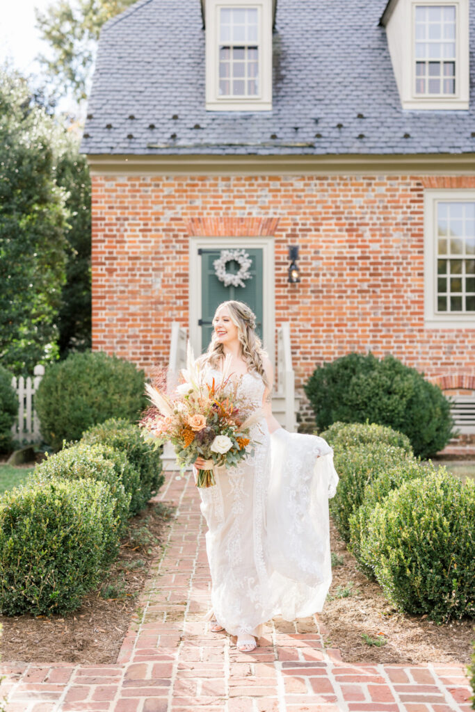 bridal holding train and walking photo during golden hour Seven Springs Richmond Va wedding