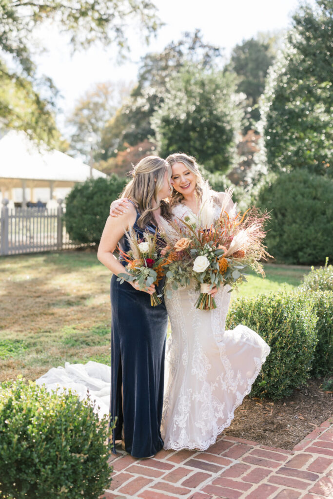 bride and bridesmaid portraits outside Seven Springs Richmond wedding