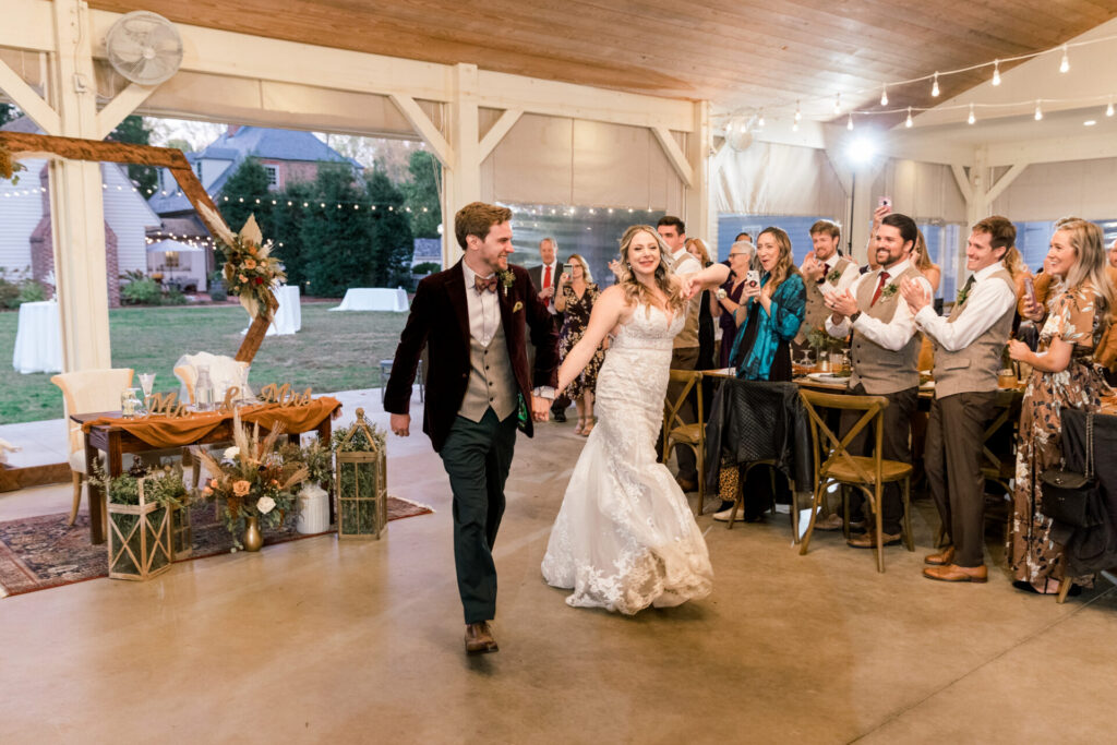 bride and groom reception entrance Seven Springs wedding