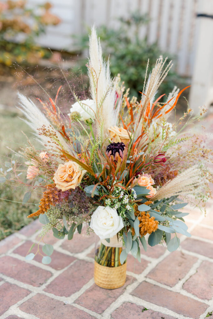 Terracotta wedding bouquet photo outside Seven Springs Richmond VA