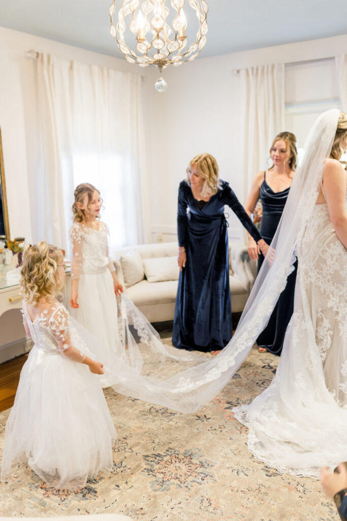 flower girl and mother holding veil Seven Springs Richmond Va Wedding