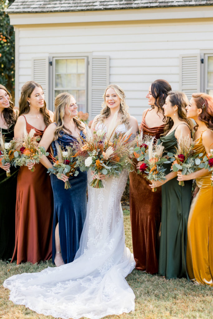 bride and bridesmaids photo in blue terracotta orange dresses Seven Springs Richmond VA Wedding