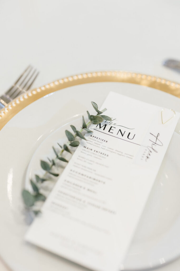 white and gold plates withe reception menu Founders Inn Wedding Virginia Beach